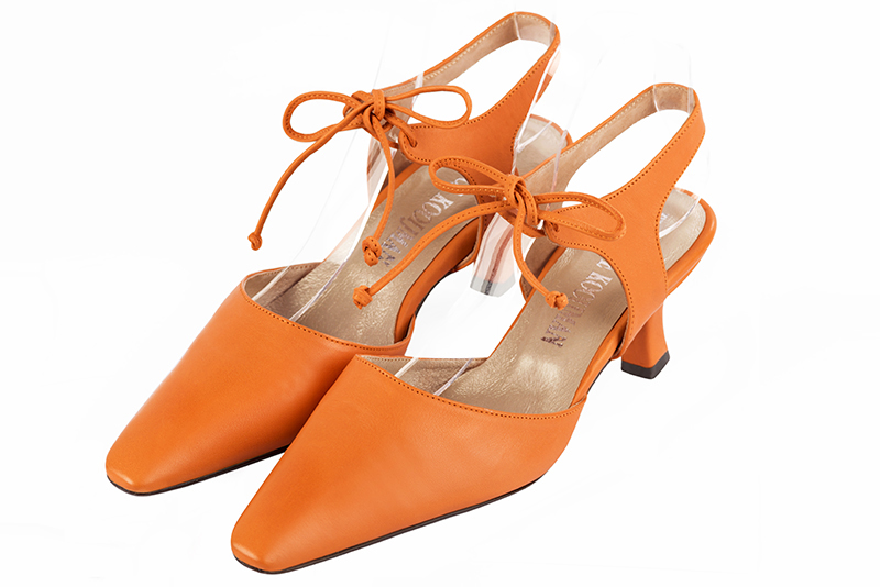 Apricot orange women's open back shoes, with an instep strap. Tapered toe. Medium spool heels. Front view - Florence KOOIJMAN